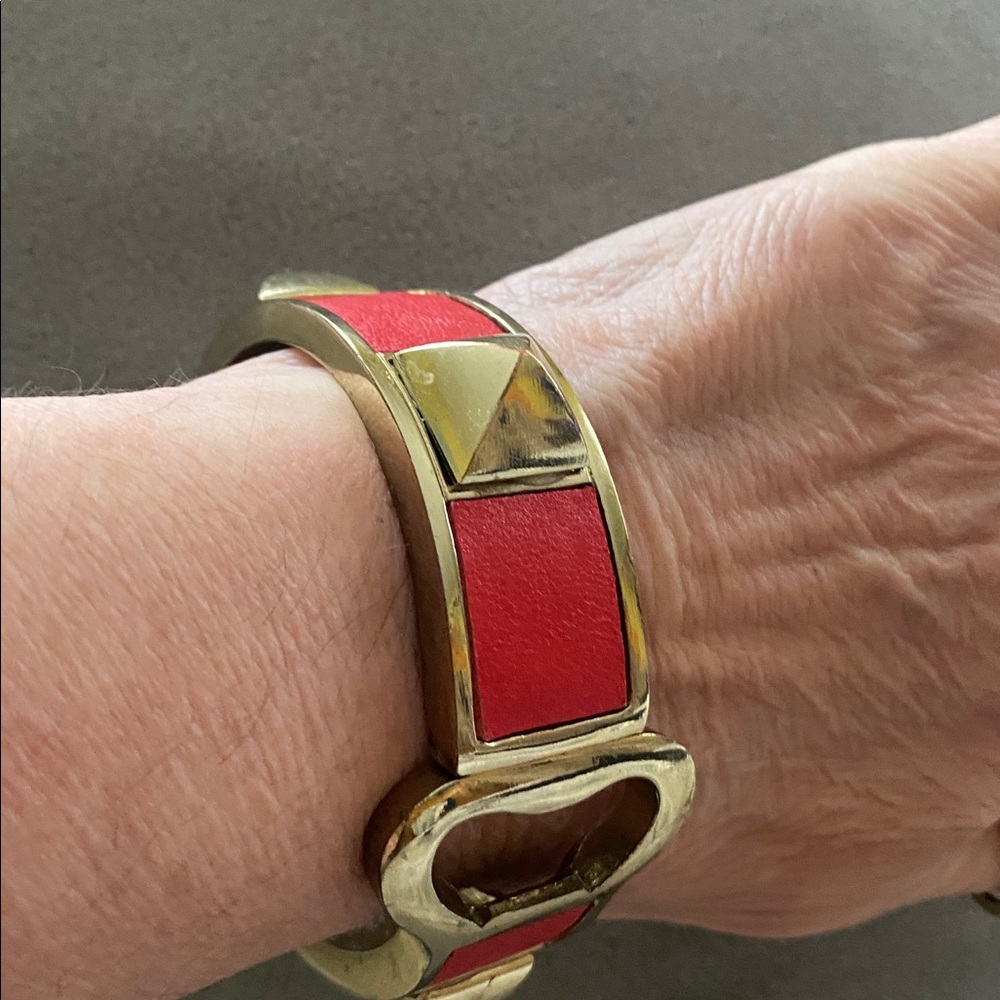 SPIKED bracelet WITH NON-FUNCTIONAL BOTTLE OPENER DESIGN